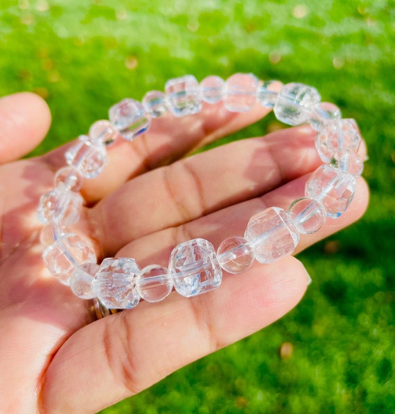 Clear quartz crystal bracelet with transparent beads, symbolizing energy amplification, mental clarity, and spiritual healing. Ideal for meditation, chakra alignment, and intention setting.