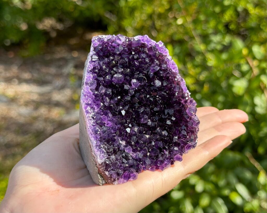 Raw amethyst crystal cluster with deep purple hues, symbolizing intuition, emotional healing, and crown chakra activation. Ideal for meditation, energy work, and spiritual growth.