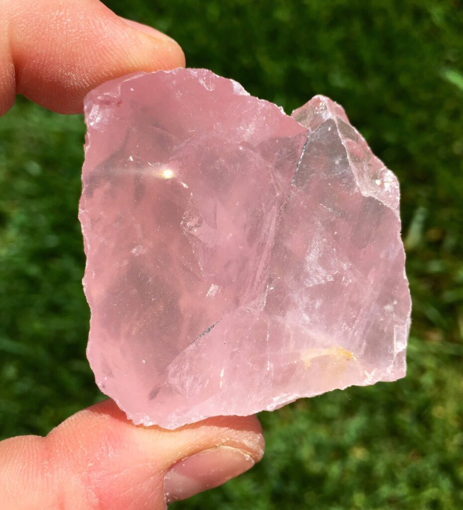Raw rose quartz crystal with soft pink hues, symbolizing love, emotional healing, and heart chakra energy. Ideal for spiritual rituals, meditation, and holistic wellness.